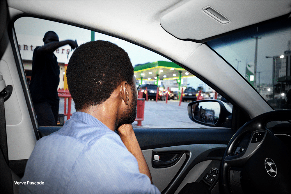 man at a filling station