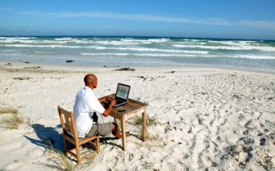 a person working remotely from the side of the beach