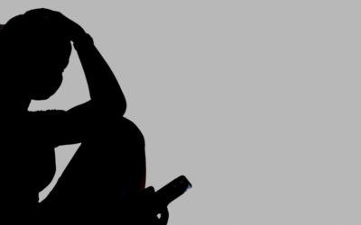 A silhouette of a person in a distressed state