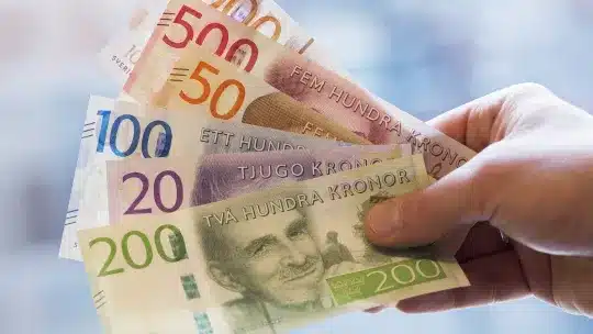 What Sweden and India can teach Nigeria about the cashless economy 1 A hand holding Swedish Krona