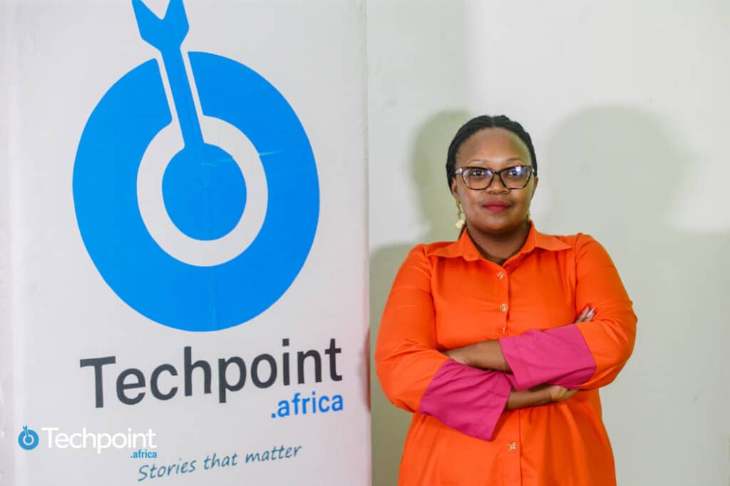 From media to program management: How Brenda Wangari is making a name for herself in Africa’s tech ecosystem 1 Brenda Wangari posing beside a Techpoint Africa Logo