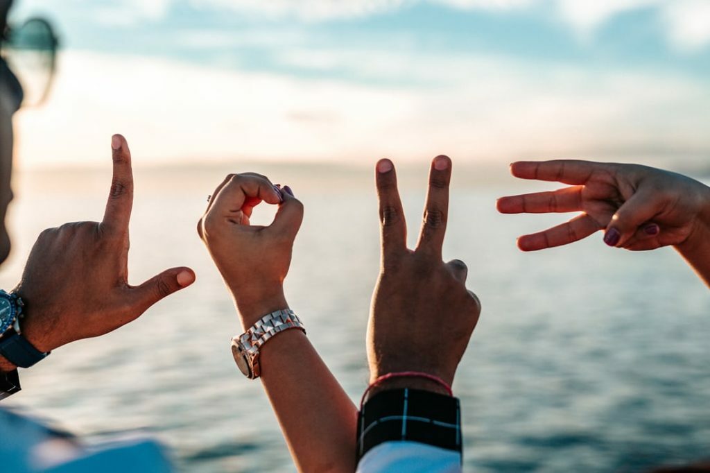 Why more people would give office romance a shot in 2023 1 Hand signs showing love