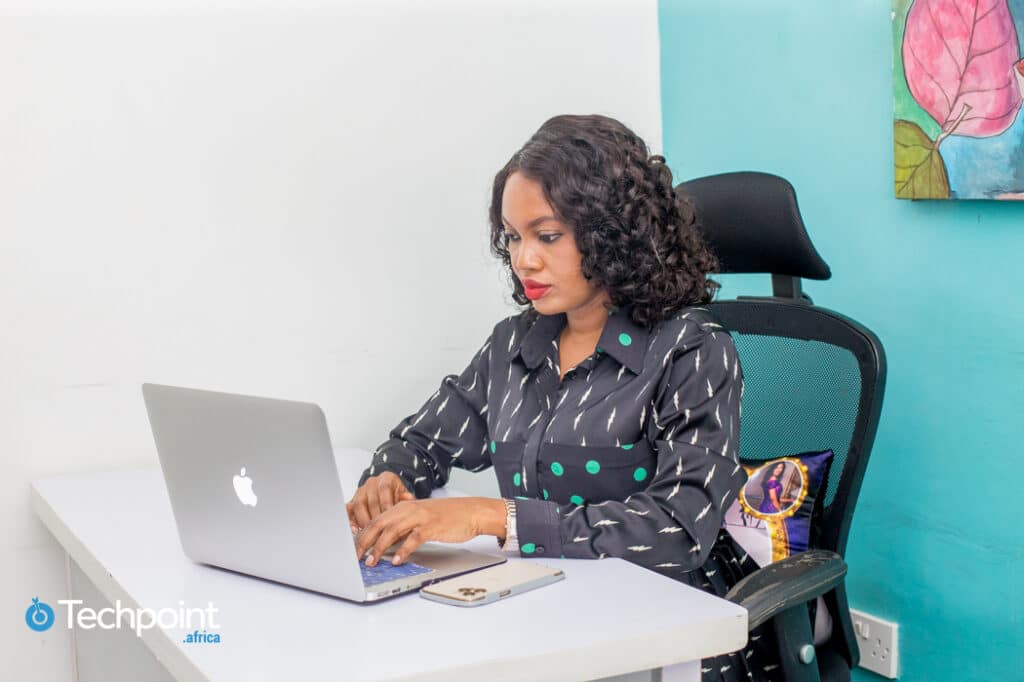Entrepreneurs.ng's Florence Chikezie built businesses that work and now helps other entrepreneurs to do the same 4 An image of Florence Chikezie, founder, ReDahlia/Entrepreneurs.ng is working on her laptop