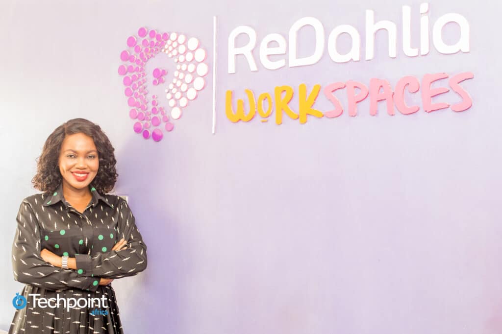 Entrepreneurs.ng's Florence Chikezie built businesses that work and now helps other entrepreneurs to do the same 3 A picture of Florence Chikezie, standing beside a wall with Redahlia workspaces written on it