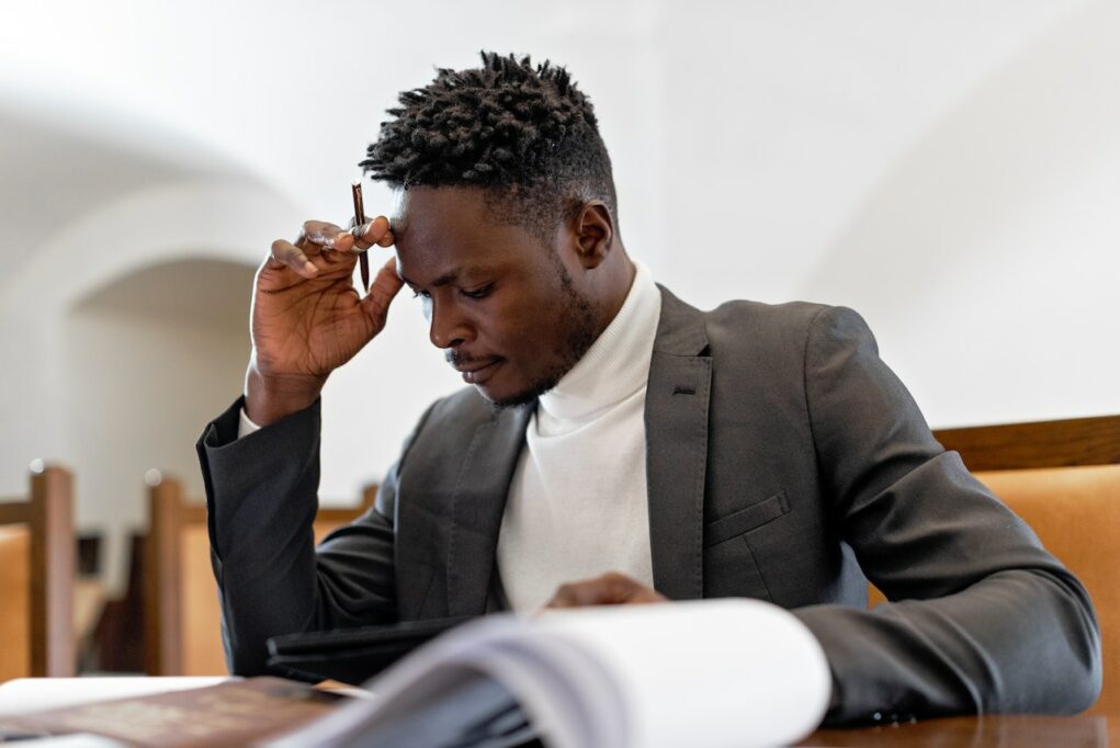 How to protect Africa's workforce from layoffs: Lessons from Europe 2 A Man in Gray Suit Sitting Near the Table while Thinking