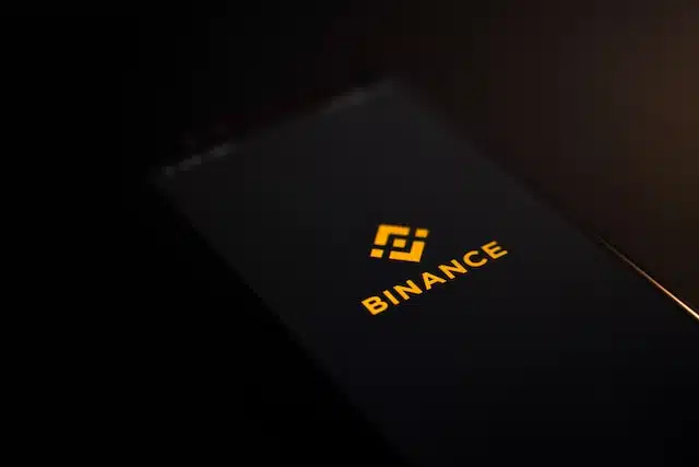 Binance logo on a phone