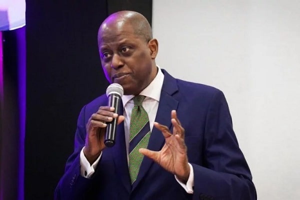 CBN to freeze bank accounts without BVN and NIN by April 2024 1 CBN governor, Yemi Cardoso holding a mic at what appears to be an event where he's addressing people