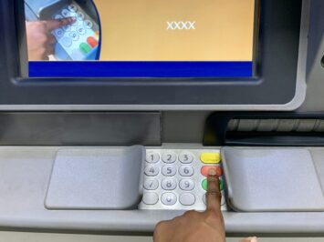 Image showing someone trying to use the ATM