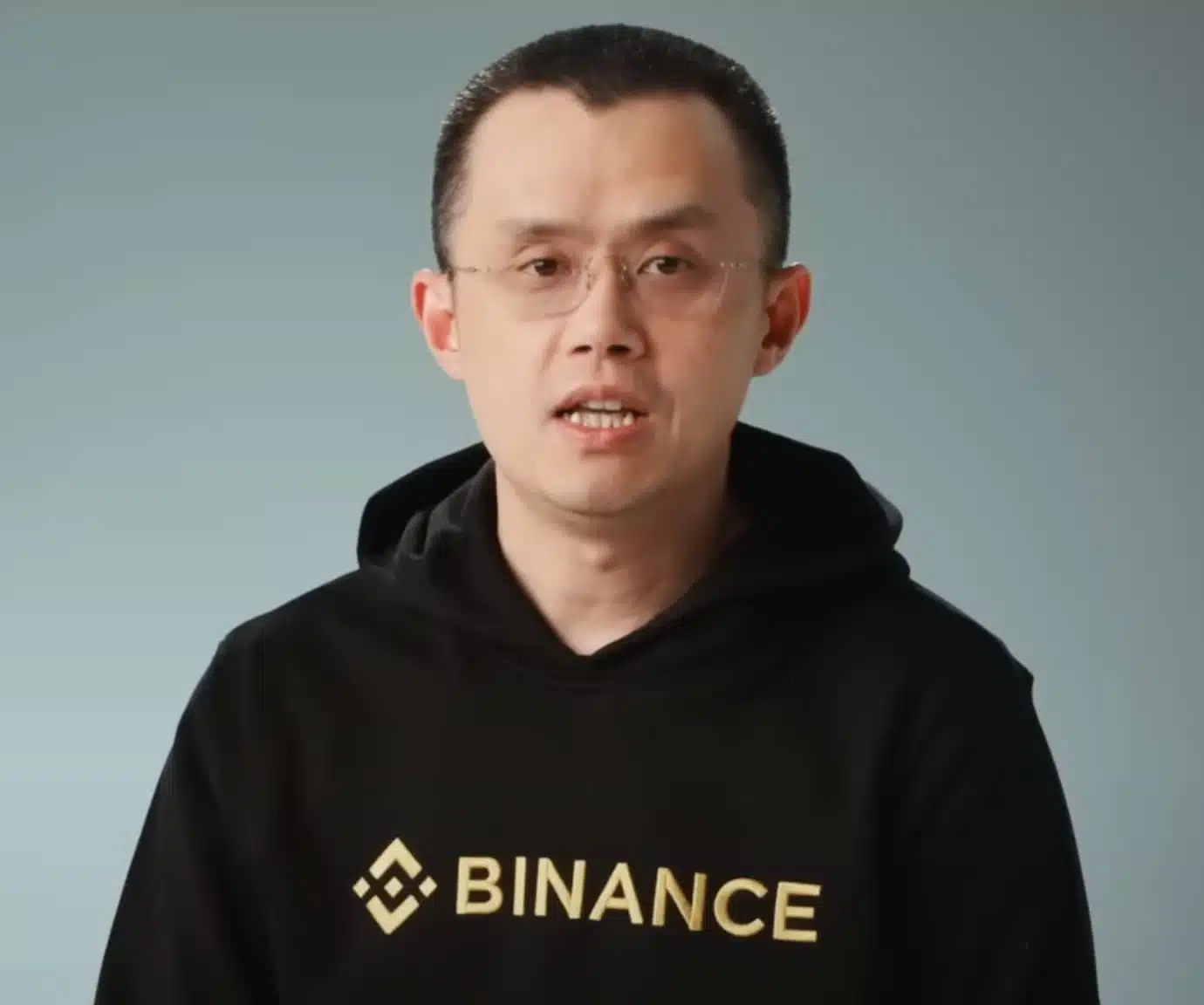 An image of the Binance CEO wearing a black hoody with Binance logo on it