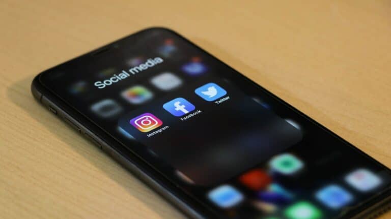 A phone showing several apps, including Instagram, Facebook, and Twitter (now X)