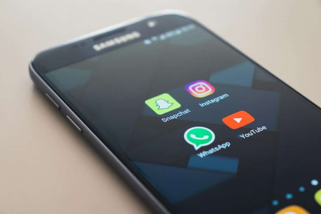 IHS Holding is considering the sale of its towers 3 A phone showing apps: Snapshat, Instagram, WhatSApp, and YouTube