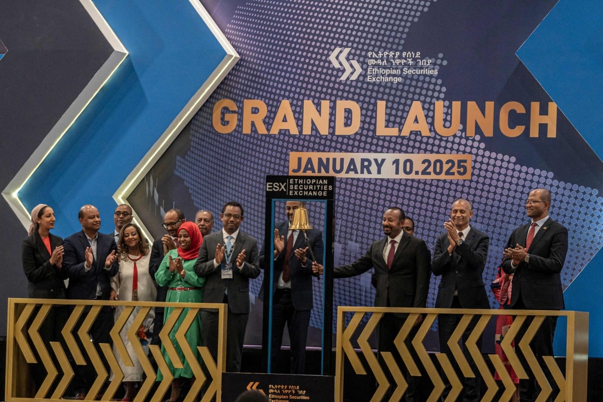 Ethiopia's Prime Minister Abiy Ahmed (3rd R) rings the bell during the launch of Ethiopian Securities Exchange in Addis Ababa, Ethiopia, on January 10, 2025