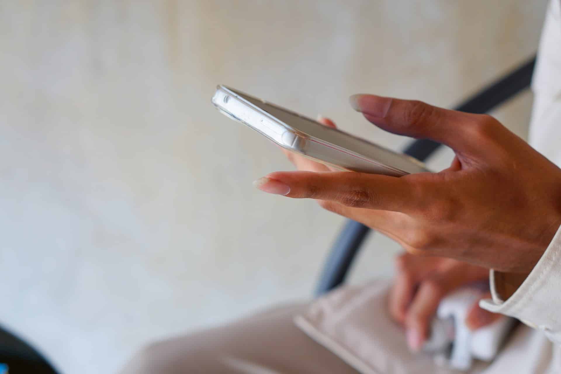 Ghana plans to reduce the cost of mobile data 1 hand holding a phone